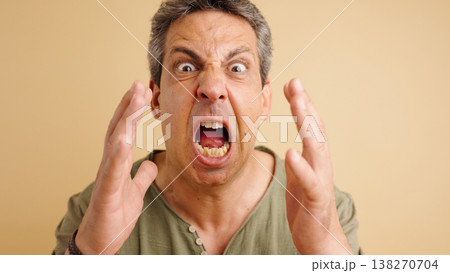 Mature man screaming in rage and frustration 138270704