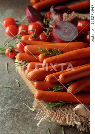 Thin smoked sausages with tomatoes, onion, garlic, and rosemary. Thin smoked sausages with tomatoes, onion, garlic, and rosemary. 138270947