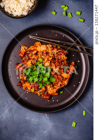 Fried kimchi with pork onions and spices. Traditional Korean food Fried kimchi with pork onions and spices. Traditional Korean food 138271447