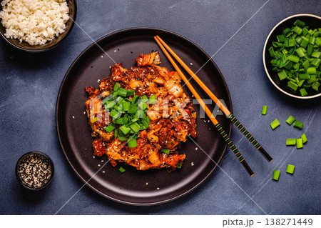 Fried kimchi with pork onions and spices. Traditional Korean food Fried kimchi with pork onions and spices. Traditional Korean food 138271449
