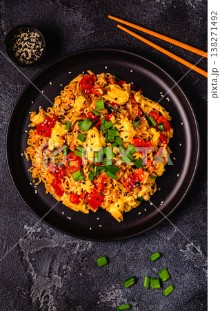 Korean style instant noodle, Shin Ramyeon with tomatoes and scrambled eggs. Korean style instant noodle, Shin Ramyeon with tomatoes and scrambled eggs. 138271492