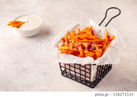 Sweet potato fries with blue cheese sauce. 138271533
