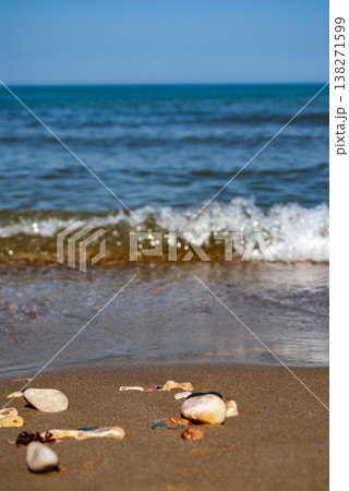 Ocean Waves Washing Over Pebbles on a Sandy Beach Ocean Waves Washing Over Pebbles on a Sandy Beach 138271599