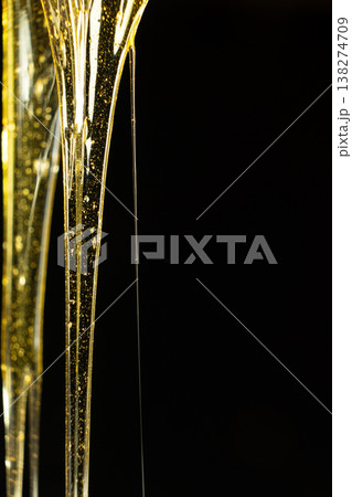 Macro Texture Of Liquid Fresh Honey On Black Background. Macro Texture Of Liquid Fresh Honey On Black Background. 138274709