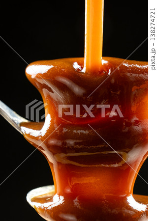 Professional food styling of hot caramel flow. Professional food styling of hot caramel flow. 138274721