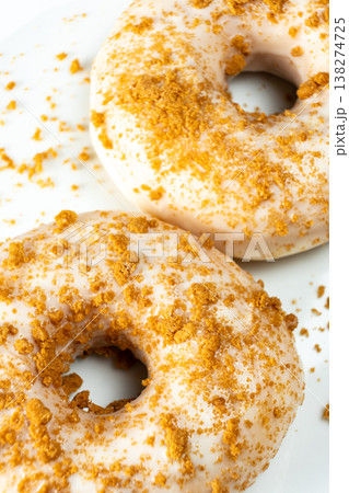 Sweet pastry donuts decorated with caramel sprinkles close up. Sweet pastry donuts decorated with caramel sprinkles close up. 138274725