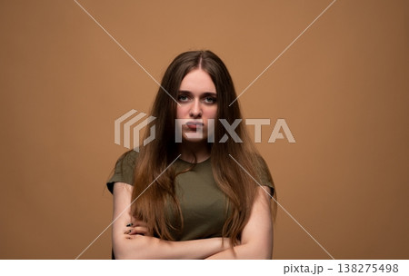 Young woman having an angry mood, crossing arms and pouting, expressing sadness, disappointment, and boredom Young woman having an angry mood, crossing arms and pouting, expressing sadness, disappointment, and boredom 138275498