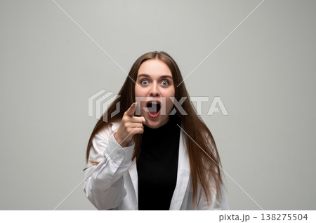 Woman feeling shocked and surprised, pointing finger, accusing or blaming, expressing disbelief and anger Woman feeling shocked and surprised, pointing finger, accusing or blaming, expressing disbelief and anger 138275504