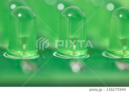 Green LED lights on circuit board, close-up macro technology background 138275949