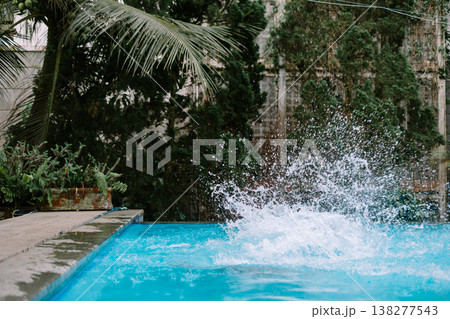 Man jumping into water during leisure time 138277543