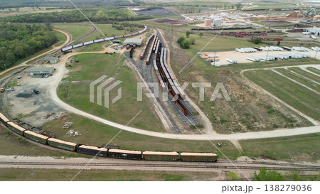 Aerial view of freight rail yard with cargo train cars and tracks 138279036
