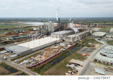 Aerial view of industrial complex with factory buildings and smokestacks 138279047