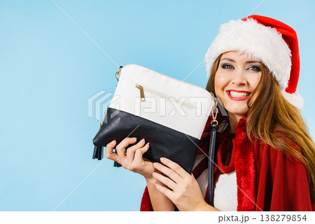 Christmas happy girl holding handbag present Christmas happy girl holding handbag present 138279854