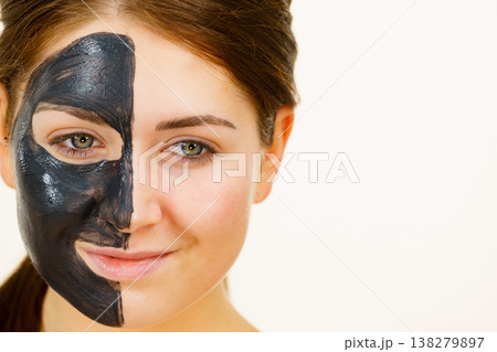 Woman with charcoal facial mask 138279897