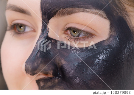 Woman with charcoal facial mask Woman with charcoal facial mask 138279898