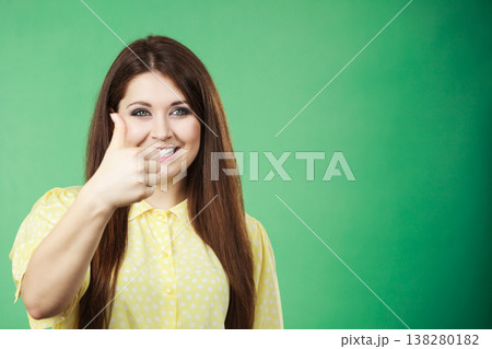 Woman making thumb up gesture Woman making thumb up gesture 138280182