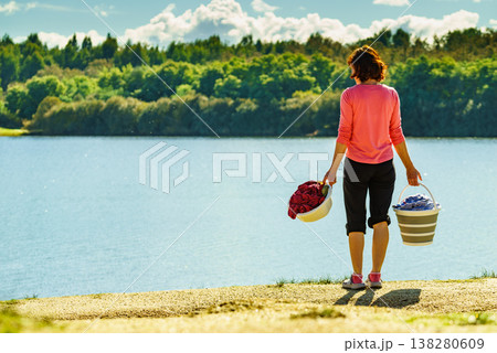 Female washing laundry on holidays trip. 138280609