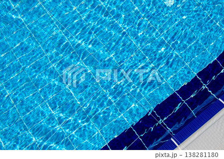 Clear Blue Swimming Pool Water With Grid Pattern and Edge Design on a Sunny Day in a Residential Area Clear Blue Swimming Pool Water With Grid Pattern and Edge Design on a Sunny Day in a Residential Area 138281180