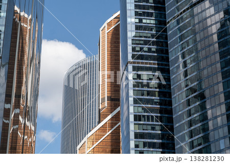 Modern Architecture in Moscow Showcases Glass and Steel Structures Against a Blue Sky With Clouds Modern Architecture in Moscow Showcases Glass and Steel Structures Against a Blue Sky With Clouds 138281230