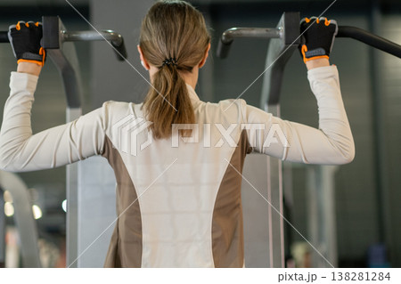 Pull Ups Training Session at Indoor Gym With Focus on Fitness and Strength Development Pull Ups Training Session at Indoor Gym With Focus on Fitness and Strength Development 138281284
