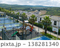 Outdoor Recreational Area Featuring Basketball Courts and Playground Equipment Near Residential Buildings in a Mountainous Region 138281340