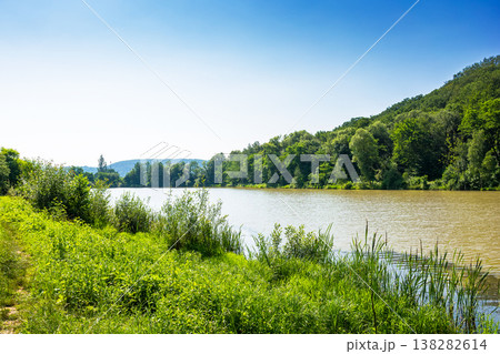small lake near deciduous forest. wonderful landscape in summer. calm sunny forenoon in carpathian mountains. rustic scenery under clear azure sky. remote place of dubky lake for relaxation small lake near deciduous forest. wonderful landscape in summer. calm sunny forenoon in carpathian mountains. rustic scenery under clear azure sky. remote place of dubky lake for relaxation 138282614