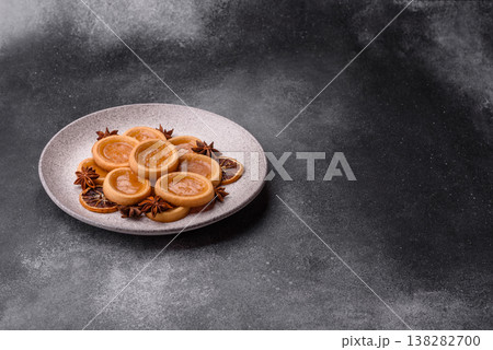 Round mini tartlets with citrus or peach jam and crumbly pastry. Mini citrus tarts 138282700