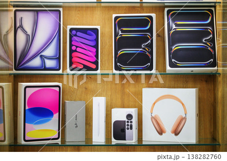 Neatly arranged tech boxes on glass shelves Neatly arranged tech boxes on glass shelves 138282760