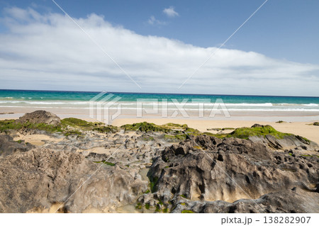 Landscape of Porto Santo Island, Portugal. A coastal scene shows textured rocks Landscape of Porto Santo Island, Portugal. A coastal scene shows textured rocks 138282907