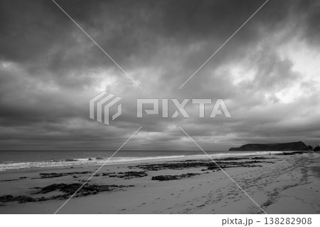 Porto Santo beach view with shore waves under dramatic cloudy sky, black and white Porto Santo beach view with shore waves under dramatic cloudy sky, black and white 138282908