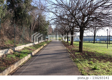 Sunny walking path in a public park in Castenedolo, Brescia, Italy Sunny walking path in a public park in Castenedolo, Brescia, Italy 138283141