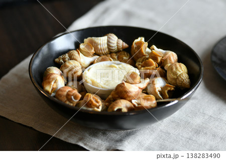French bulot sea snails with sauce traditional seafood delicacy plate French bulot sea snails with sauce traditional seafood delicacy plate 138283490