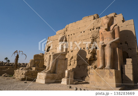 Karnak Temple is dedicated to the temple complex of Ancient Egypt in honor of the god Amun-Ra, his wife Mut and son Khons. Thebes, Karnak, Luxor, Egypt Karnak Temple is dedicated to the temple complex of Ancient Egypt in honor of the god Amun-Ra, his wife Mut and son Khons. Thebes, Karnak, Luxor, Egypt 138283669