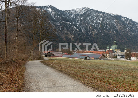 Curving road leading to alpine church and mountain village Curving road leading to alpine church and mountain village 138285065