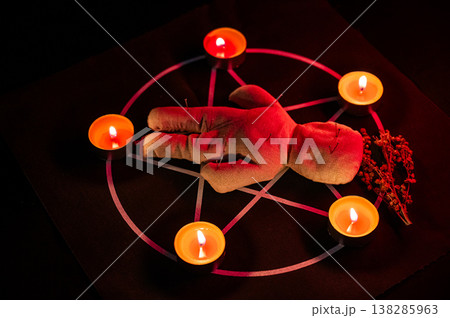 Voodoo doll on a pentagram. Witch spells. 138285963