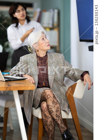 In study room, female business colleagues listens to lecture, look to presentation. In study room, female business colleagues listens to lecture, look to presentation. 138288143