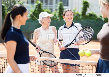 Tennis match female participants chat after game Tennis match female participants chat after game 138288152