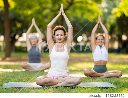 Adult woman doing yoga in lotus position Adult woman doing yoga in lotus position 138288382