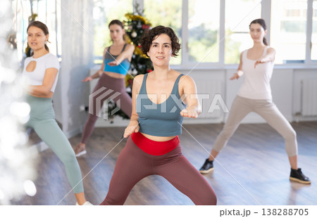 Slender young women dancers dance a swing steps in modern way during the Christmas celebration 138288705