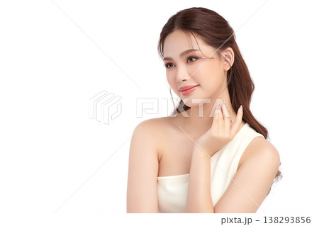 A beautiful young Asian woman with clean, fresh skin against a white background. Skincare, facial treatment, cosmetology, beauty, and spa. An elegant portrait of an Asian woman. 138293856