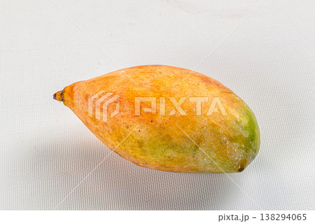 Two ripe tropical mango fruits on a rustic background Two ripe tropical mango fruits on a rustic background 138294065