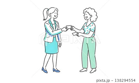 笑顔で丁寧に名刺交換をするビジネスパーソン 138294554