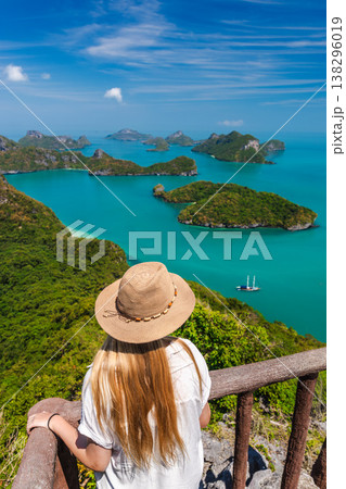 Young woman at viewpoint in Ang Thong National Marine Park overlooking tropical islands and turquoise sea Young woman at viewpoint in Ang Thong National Marine Park overlooking tropical islands and turquoise sea 138296019