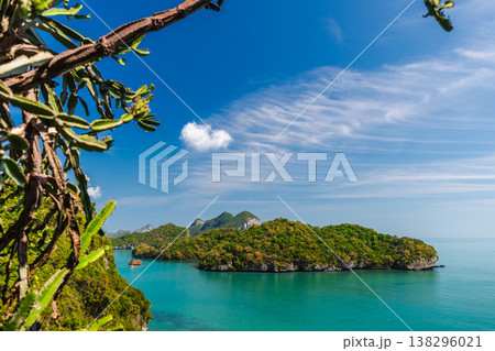 Ang Thong Marine National Park tropical island landscape with turquoise sea and green limestone cliffs under clear blue sky in Thailand Ang Thong Marine National Park tropical island landscape with turquoise sea and green limestone cliffs under clear blue sky in Thailand 138296021