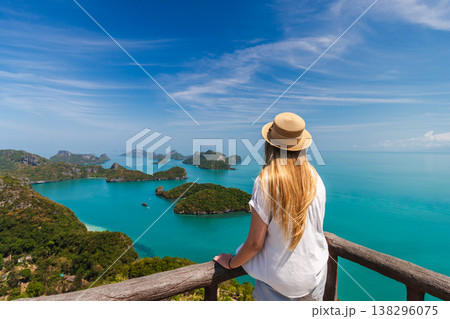 Young woman standing on viewpoint overlooking Ang Thong Marine National Park islands in Thailand 138296075