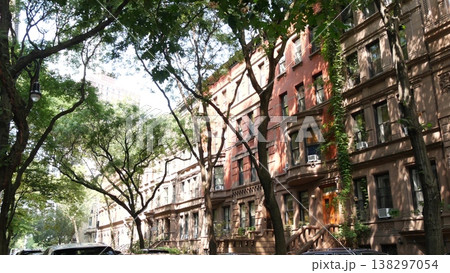 New York City townhouse buildings, residential brownstone row houses in Manhattan or Brooklyn, USA. New York City townhouse buildings, residential brownstone row houses in Manhattan or Brooklyn, USA. 138297054