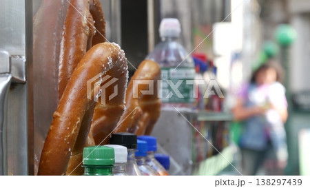 Pretzel for sale, street food in Manhattan, New York USA. Fast food pastry snack on counter or stall Pretzel for sale, street food in Manhattan, New York USA. Fast food pastry snack on counter or stall 138297439