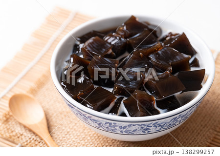 Black grass jelly in fresh milk, a refreshing Thai dessert in summer season Black grass jelly in fresh milk, a refreshing Thai dessert in summer season 138299257