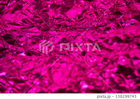 Vibrant crumpled metallic foil texture in shiny pink creases and reflections Vibrant crumpled metallic foil texture in shiny pink creases and reflections 138299743