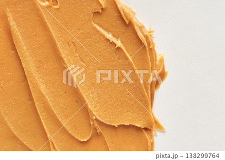 Smooth Creamy Peanut Butter Spread On White Surface Closeup Texture 138299764